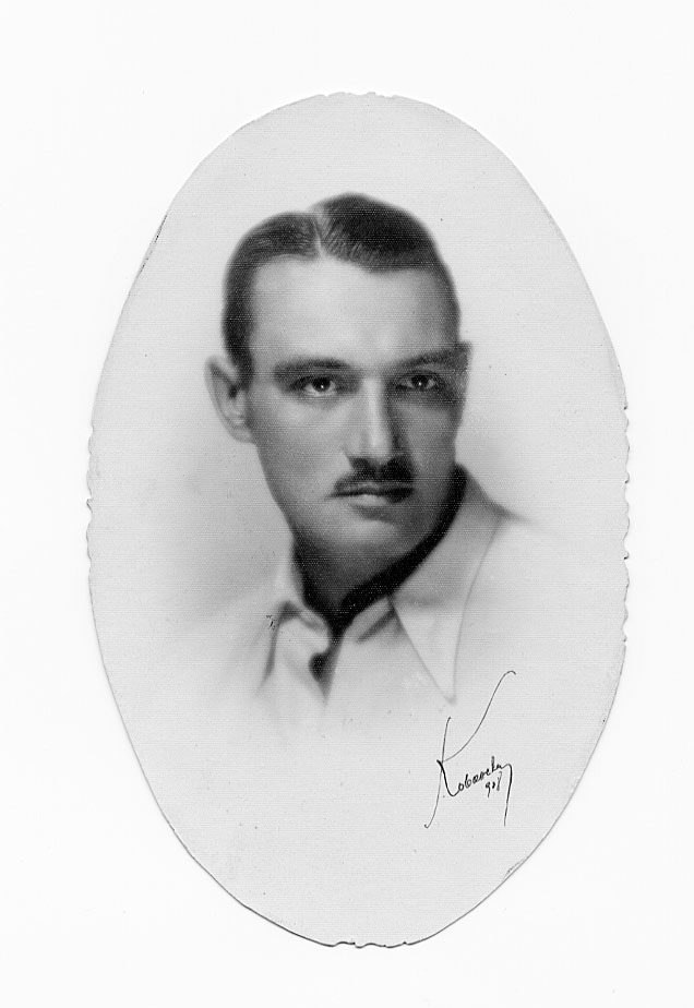 Black and white portrait of handsome man with moustache.